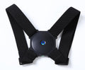 Black smart posture corrector with a black vibrator on the center