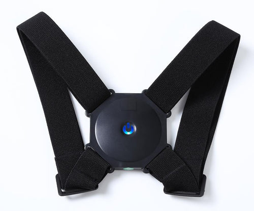Black smart posture corrector with a black vibrator on the center